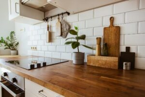 Wood countertop and ceramic white backsplace
