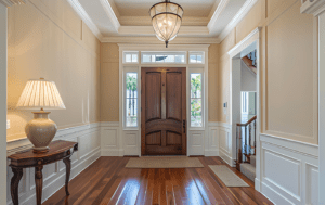 Custom entryway with wood door and warm lighting