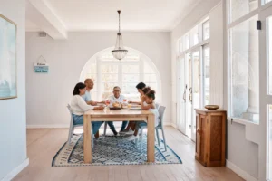 family in open concept dining room having dinner